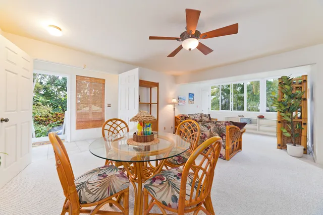 a view of a dining room with furniture window and outside view