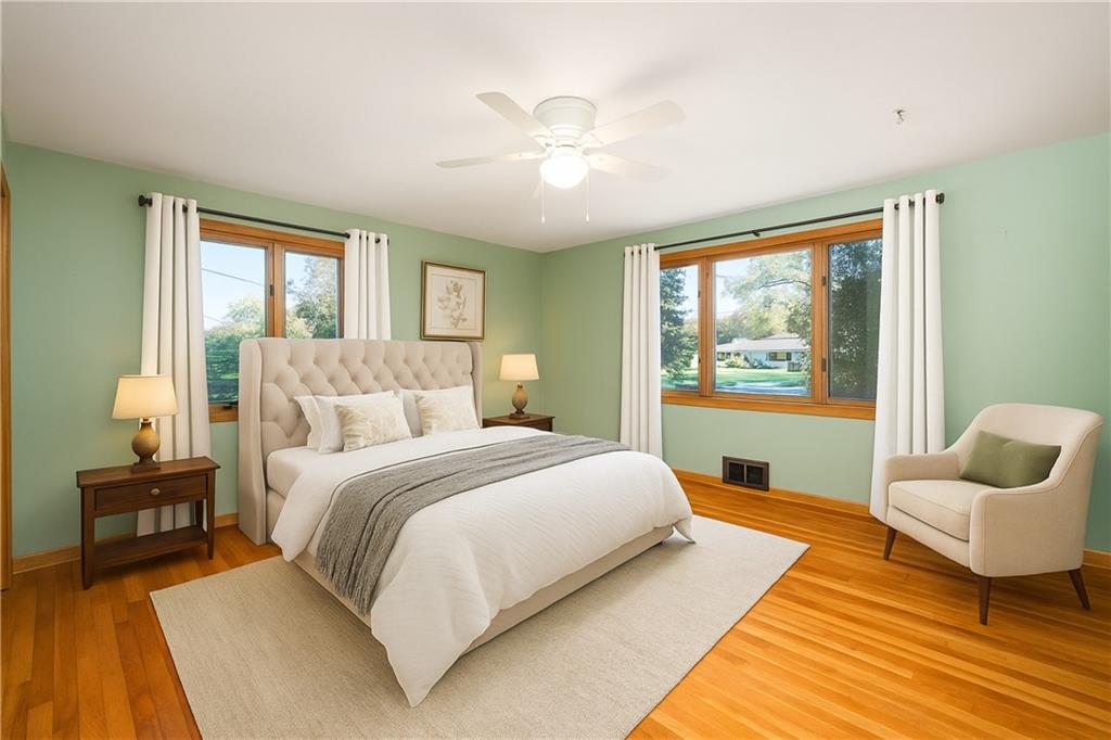 686 Christy Road Hermitage, PA 16148 - Photo 19 of 36 a spacious bedroom with a bed and wooden floor