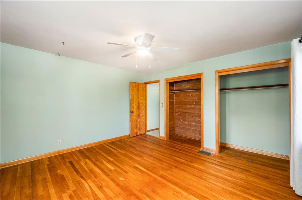 686 Christy Road Hermitage, PA 16148 - Photo 21 of 36 a view of empty room with wooden floor and fan