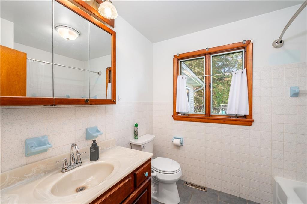 686 Christy Road Hermitage, PA 16148 - Photo 22 of 36 a bathroom with a sink vanity and toilet