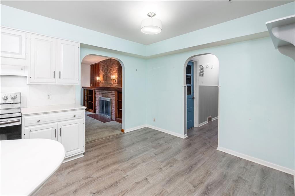 686 Christy Road Hermitage, PA 16148 - Photo 9 of 36 a kitchen with a refrigerator and white cabinets