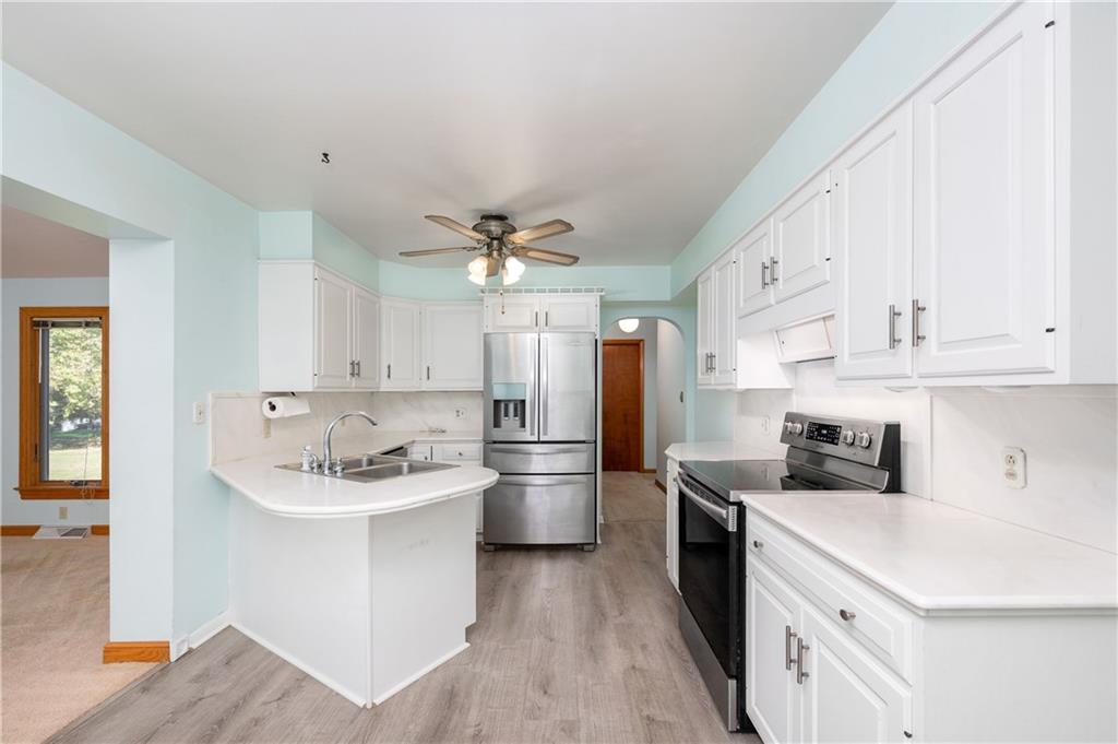 686 Christy Road Hermitage, PA 16148 - Photo 10 of 36 a kitchen with a sink cabinets stainless steel appliances and a window