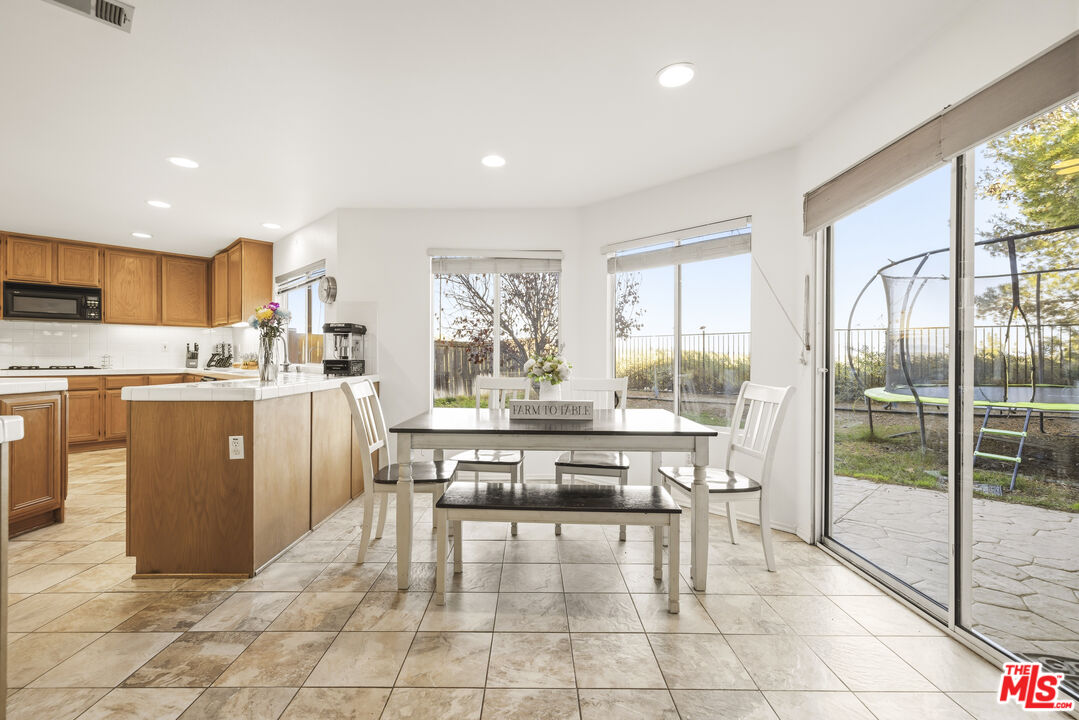 32610 Ridge Top Lane Castaic, CA 91384 - Photo 12 of 49 a kitchen with a sink a counter top space and stainless steel appliances