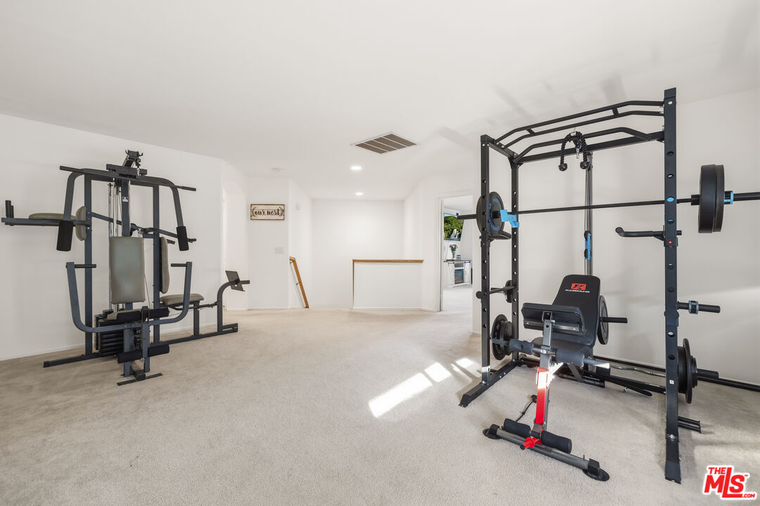 32610 Ridge Top Lane Castaic, CA 91384 - Photo 23 of 49 a view of a room with gym equipment