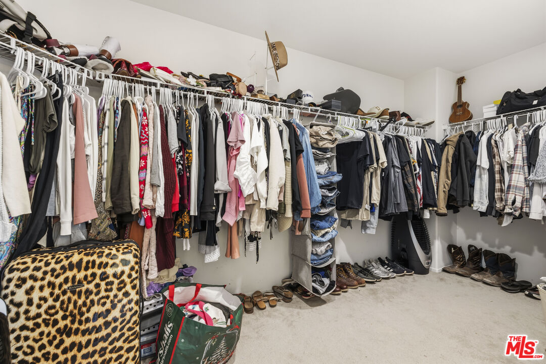 32610 Ridge Top Lane Castaic, CA 91384 - Photo 39 of 49 a view of walk in closet with clothes