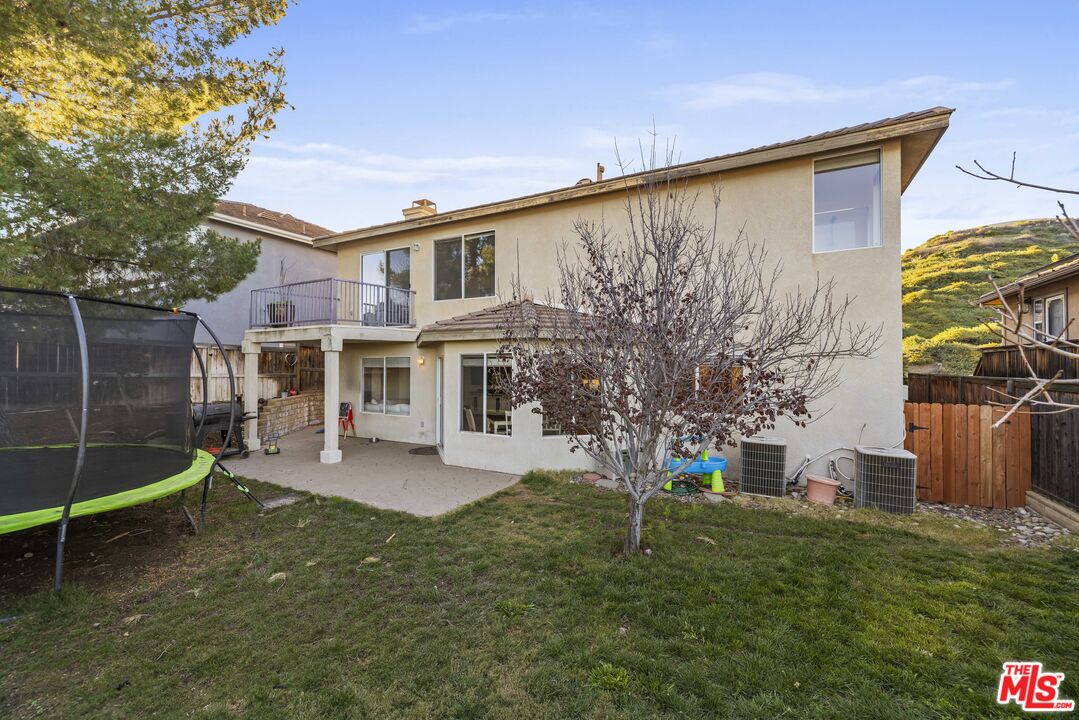 32610 Ridge Top Lane Castaic, CA 91384 - Photo 45 of 49 a view of a house with a yard