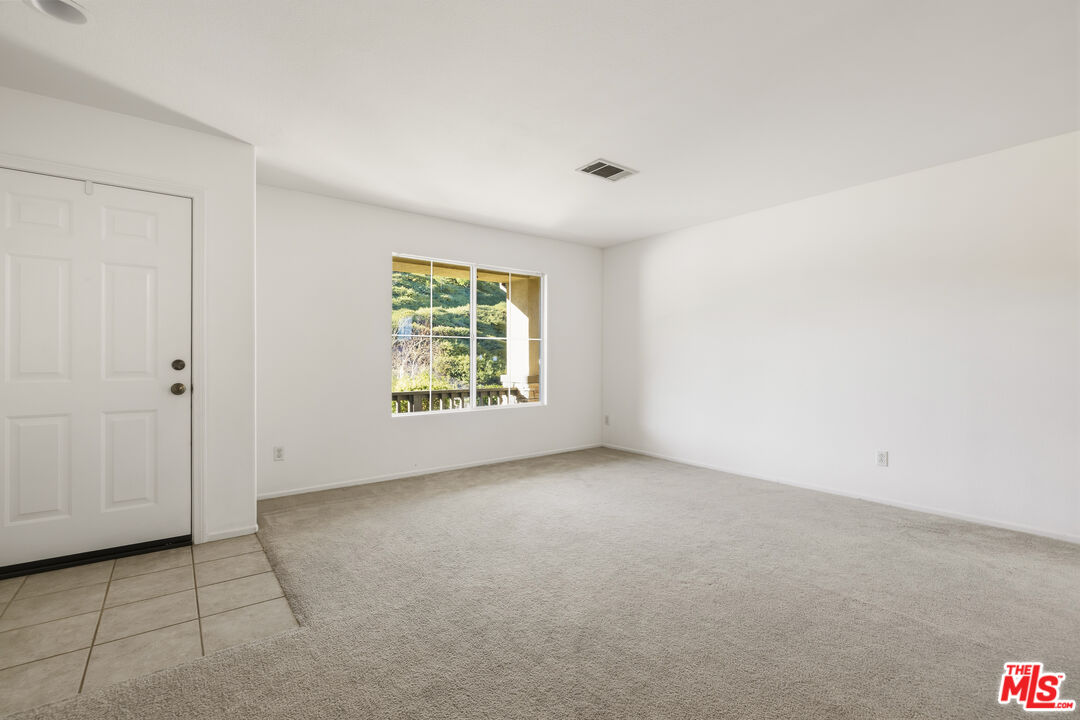 32610 Ridge Top Lane Castaic, CA 91384 - Photo 9 of 49 an empty room with windows