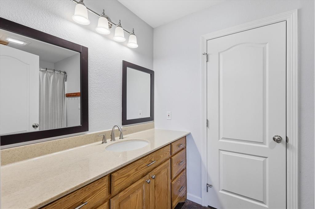 399 Brindley Road Maypearl, TX 76064 - Photo 24 of 39 Jack and Jill bathroom for bedrooms 3 and 4