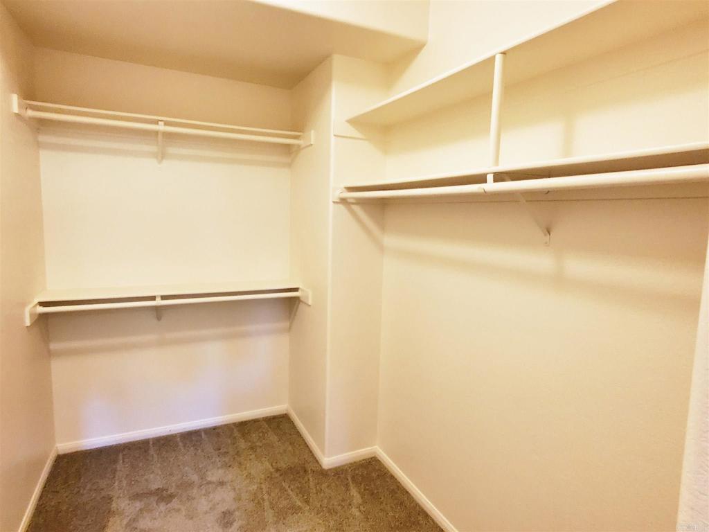 6116 Citracado Circle Carlsbad, CA 92009 - Photo 22 of 32 a view of an empty walk in closet