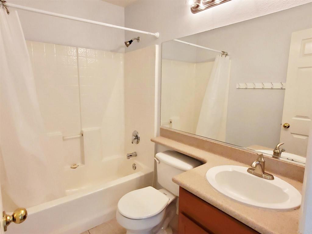 6116 Citracado Circle Carlsbad, CA 92009 - Photo 28 of 32 a bathroom with a sink toilet and shower