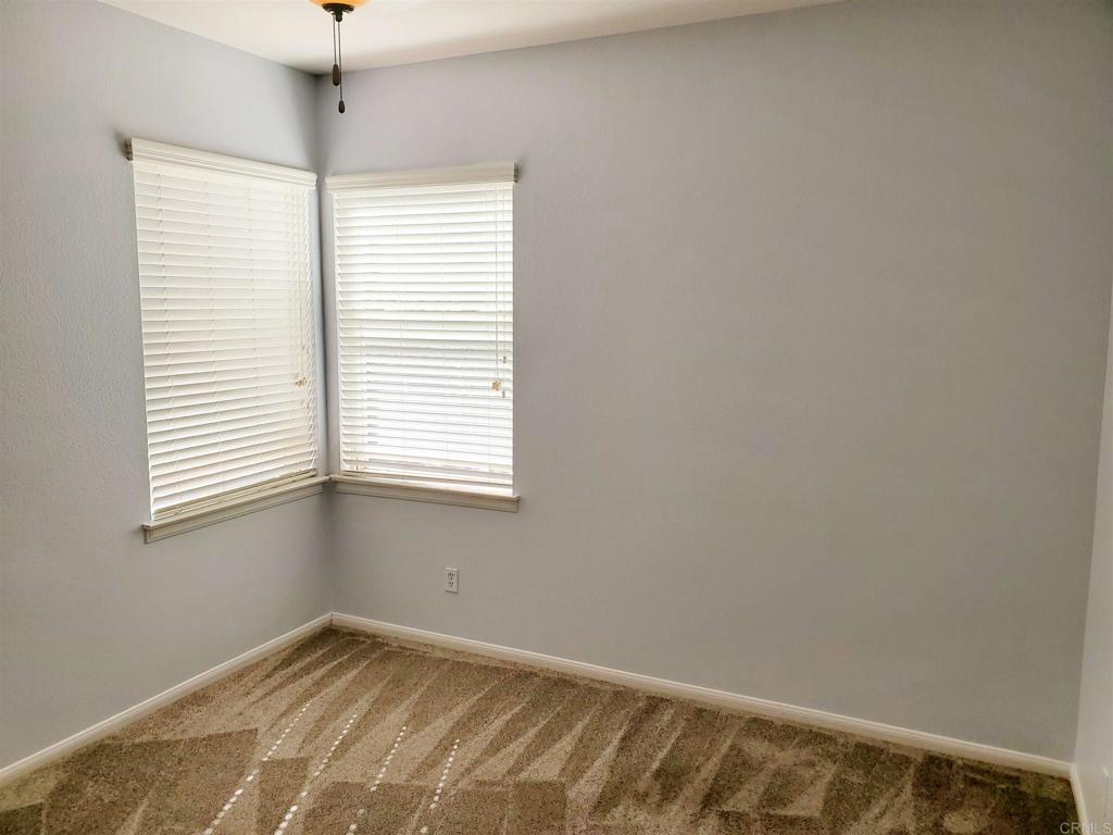 6116 Citracado Circle Carlsbad, CA 92009 - Photo 29 of 32 a view of an empty room with a window