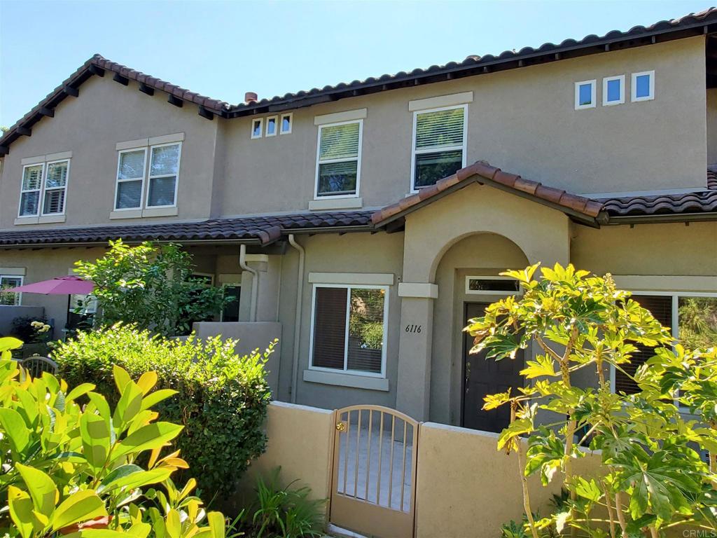 6116 Citracado Circle Carlsbad, CA 92009 - Photo 5 of 32 a front view of a house with a garden