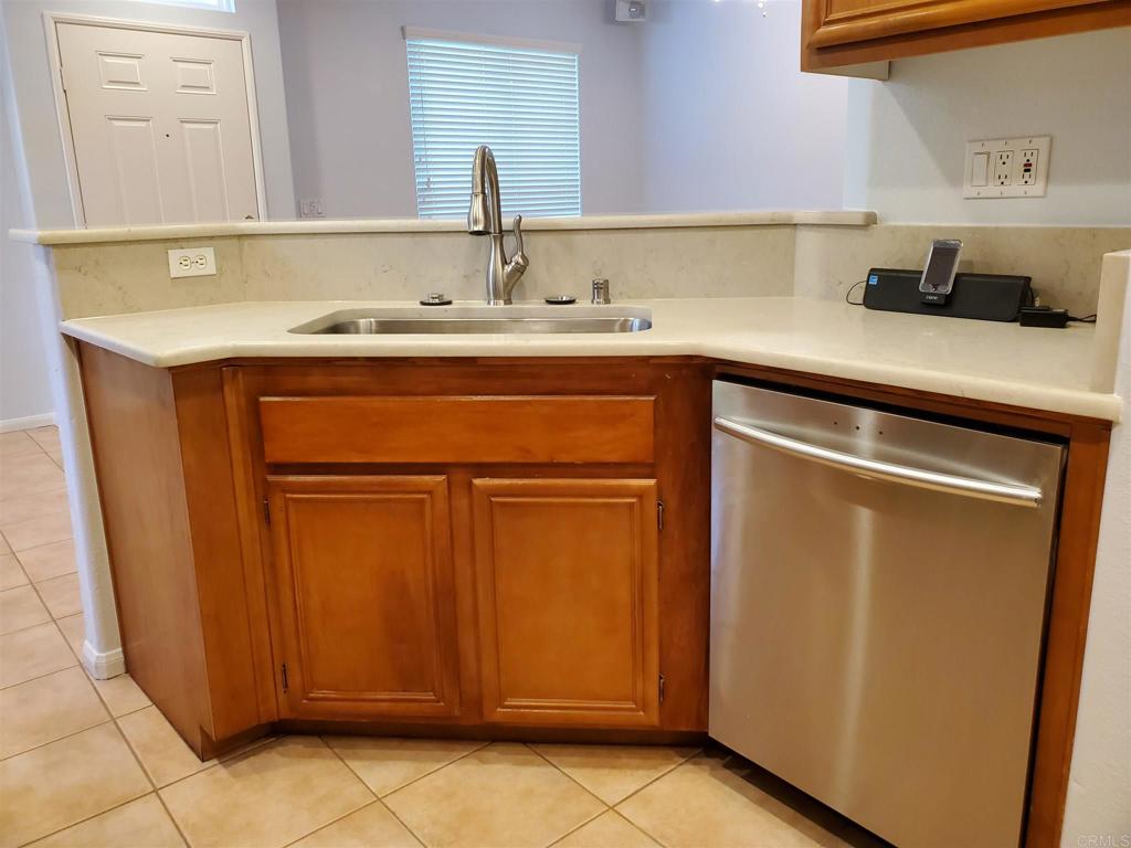 6116 Citracado Circle Carlsbad, CA 92009 - Photo 9 of 32 a kitchen with a sink and cabinets