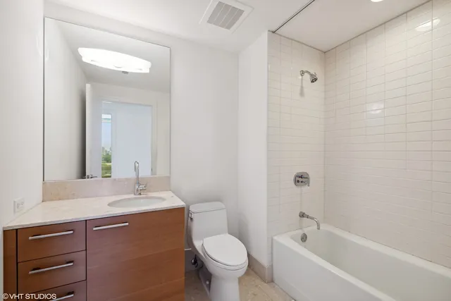 a bathroom with a sink a toilet and a bathtub