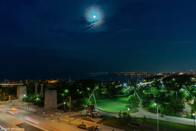 a large white kitchen with a large window