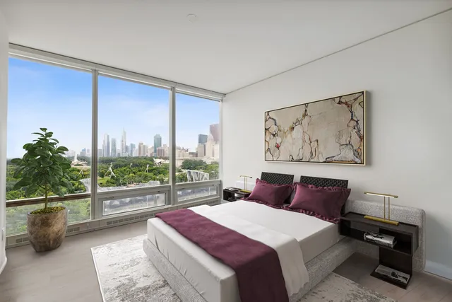 a bedroom with a large bed and a view of bedroom