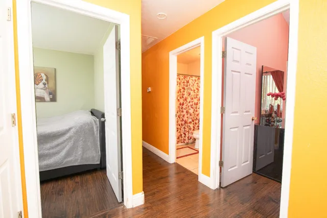 a view of a bedroom from a hallway