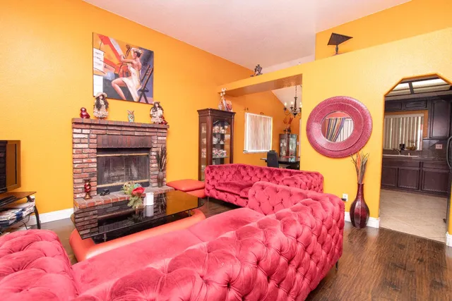 a bedroom with a bed and a fireplace