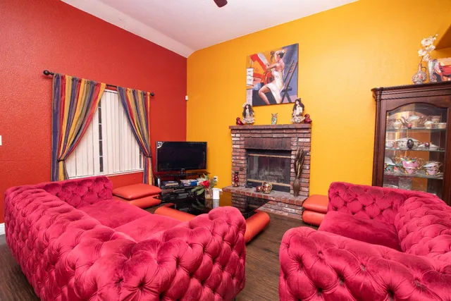 a bedroom with furniture and a fireplace