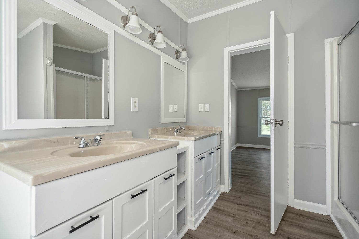 506 Charleston Gift Road Covington, TN 38019 - Photo 15 of 23 Bathroom featuring ornamental molding, double vanity,