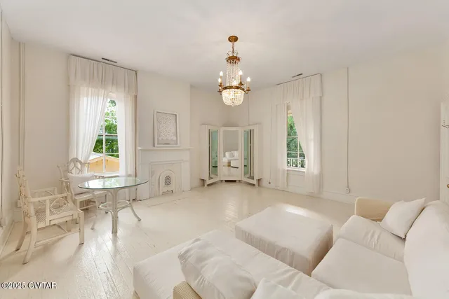 a living room with furniture and windows