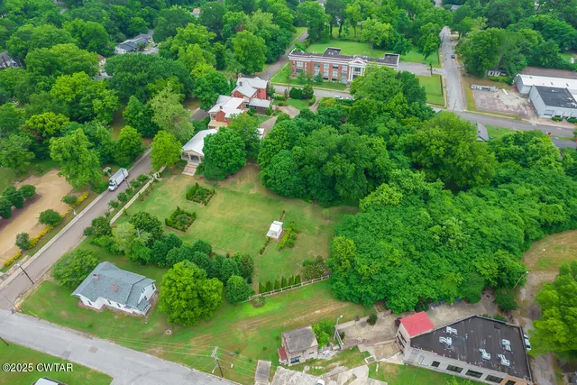 an aerial view of residential house with outdoor space and street view