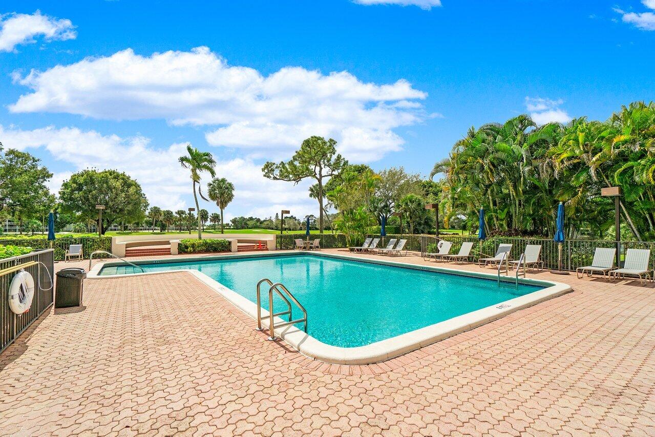 6320 Boca Del Mar Drive, Unit 302 Boca Raton, FL 33433 - Photo 34 of 35 a view of a swimming pool with an outdoor seating