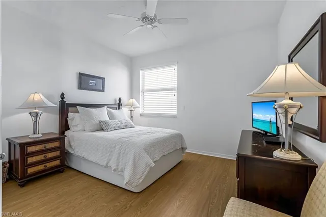 a bedroom with a bed and a lamp