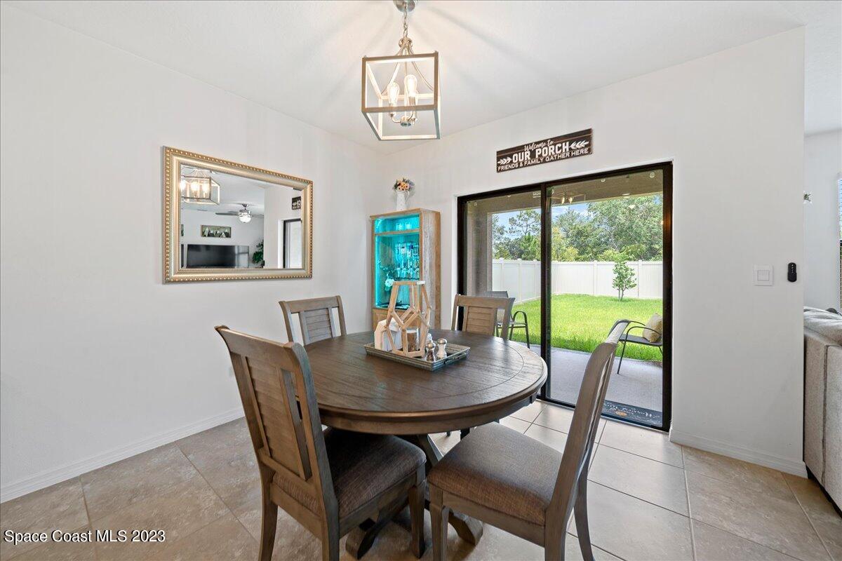 2103 Capital Drive Palm Bay, FL 32909 - Photo 16 of 84 a view of a dining room with furniture window and outside view