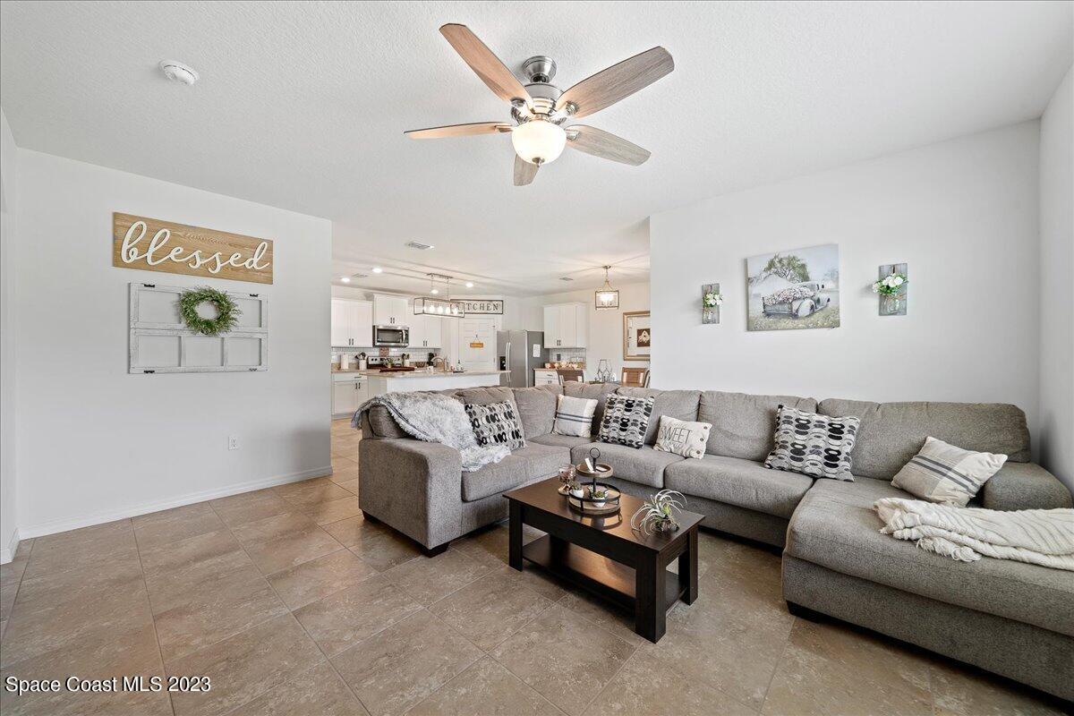 2103 Capital Drive Palm Bay, FL 32909 - Photo 20 of 84 a living room with furniture and white walls