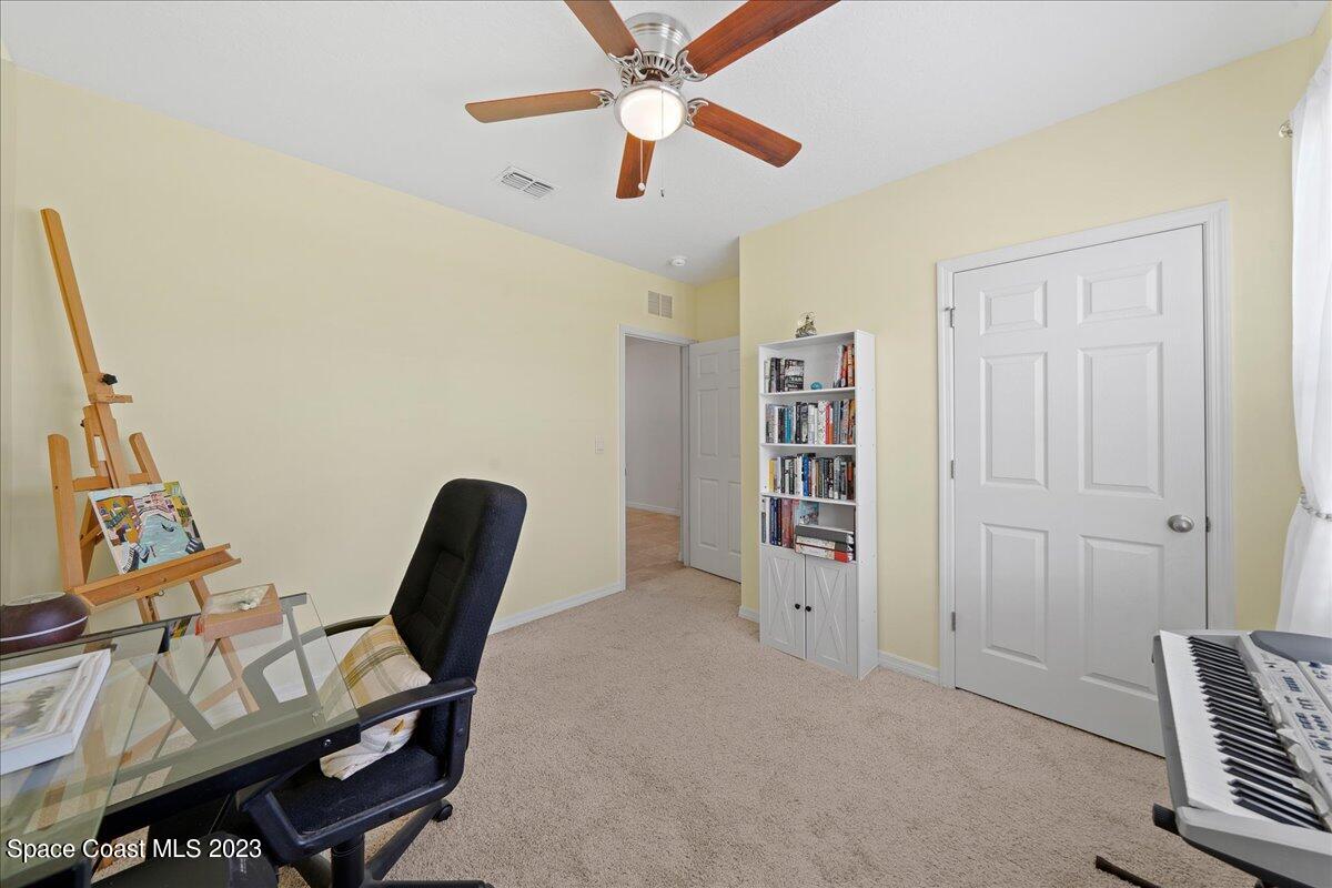 2103 Capital Drive Palm Bay, FL 32909 - Photo 27 of 84 a view of a workspace with furniture and a window