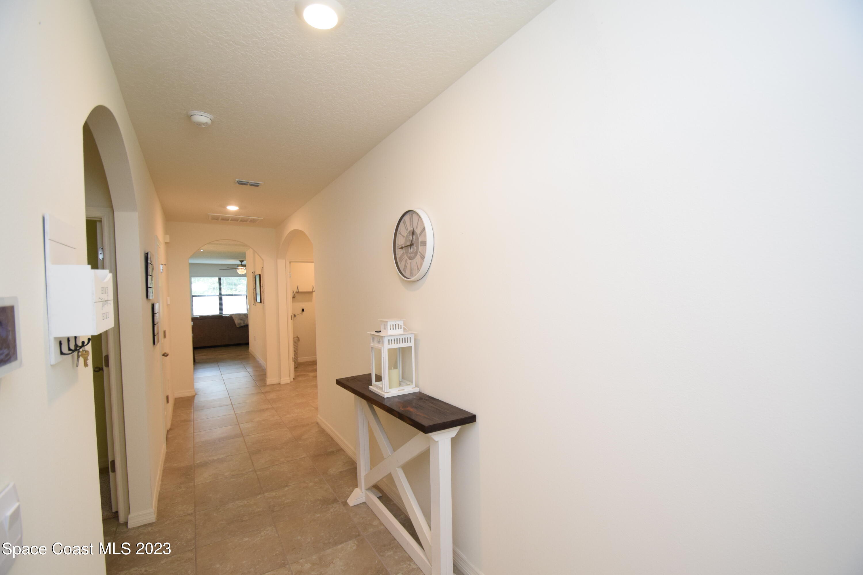 2103 Capital Drive Palm Bay, FL 32909 - Photo 35 of 84 a view of a hallway with wooden floor
