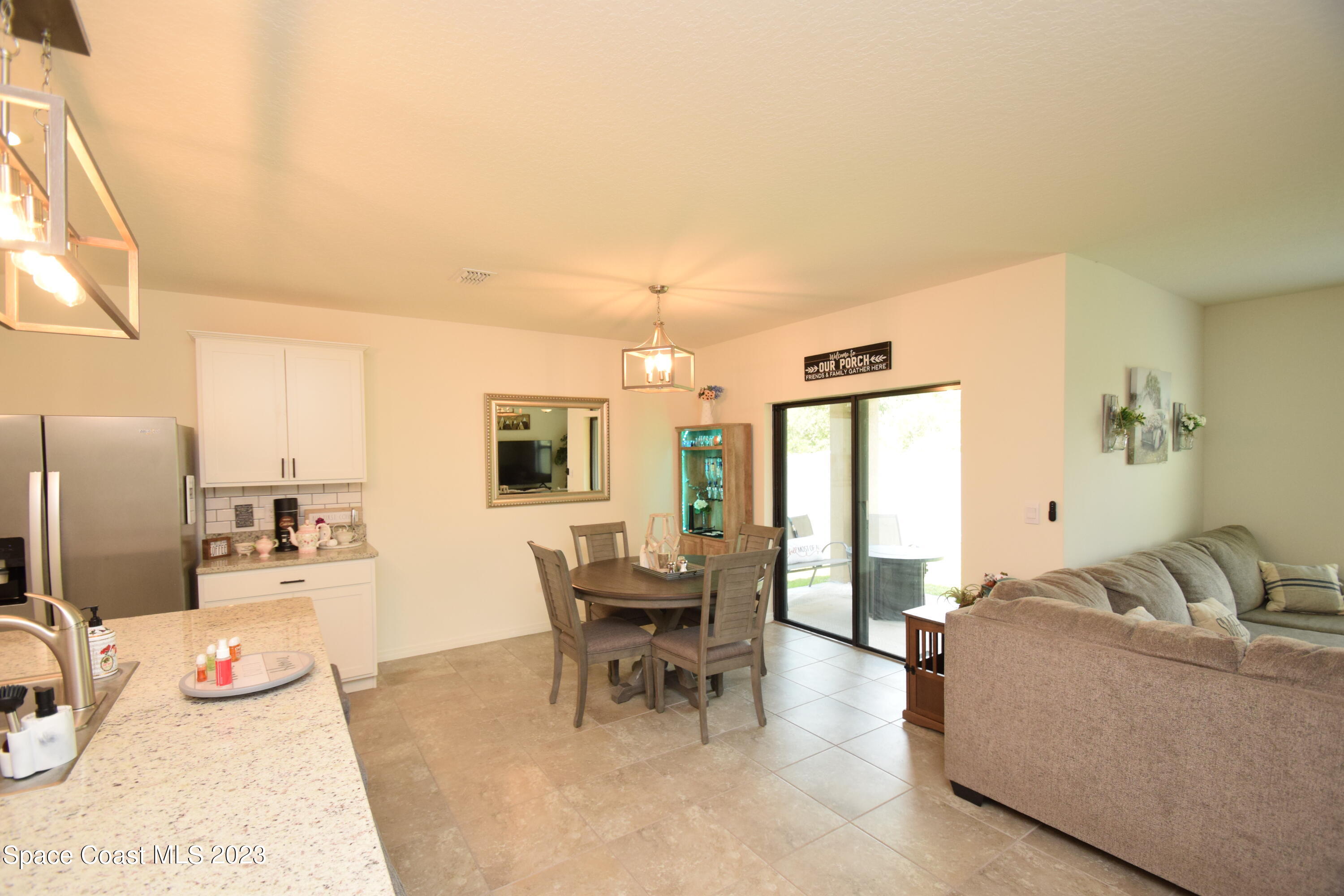 2103 Capital Drive Palm Bay, FL 32909 - Photo 44 of 84 a living room with furniture and large windows