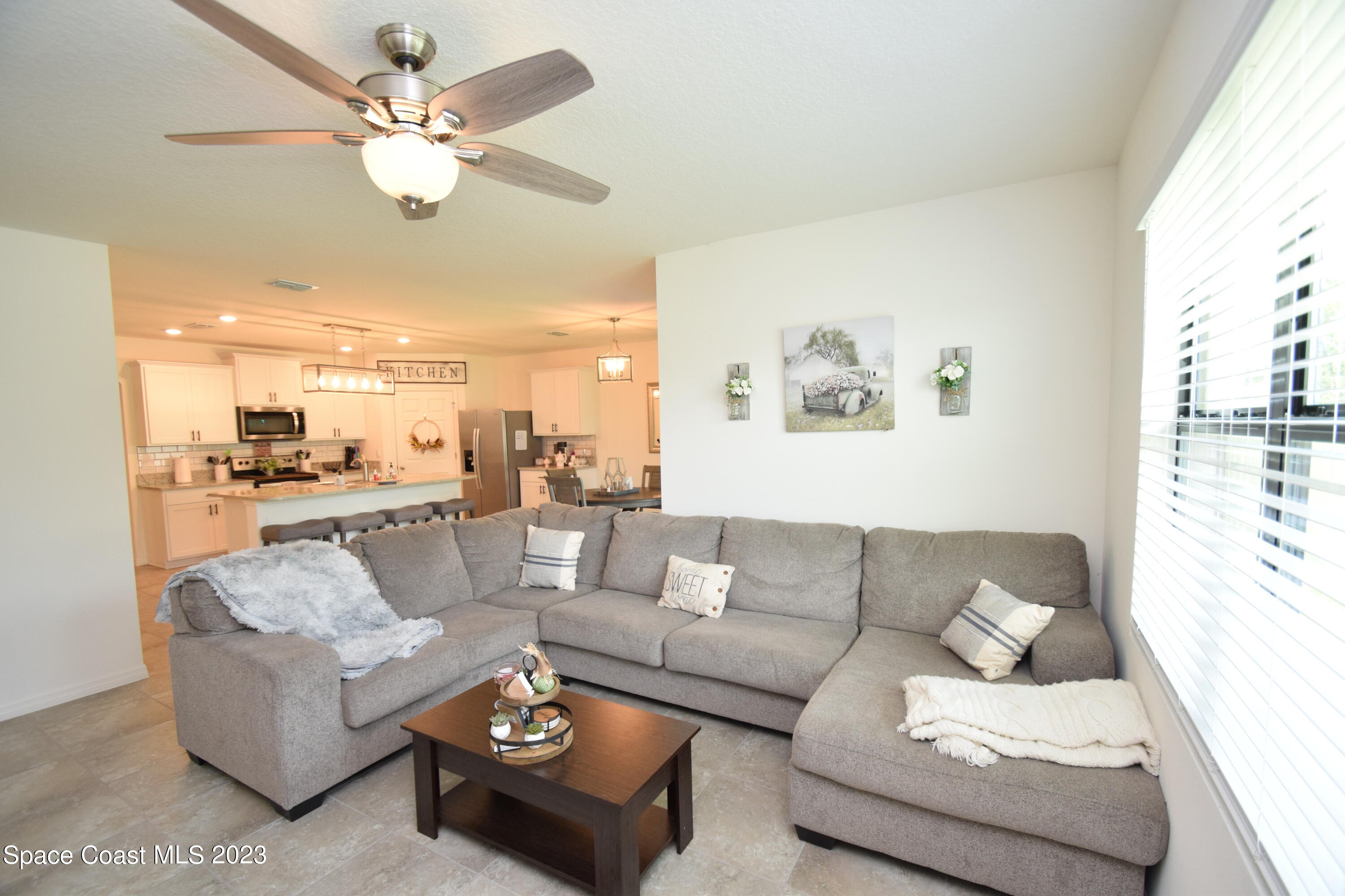 2103 Capital Drive Palm Bay, FL 32909 - Photo 46 of 84 a living room with furniture and a large window