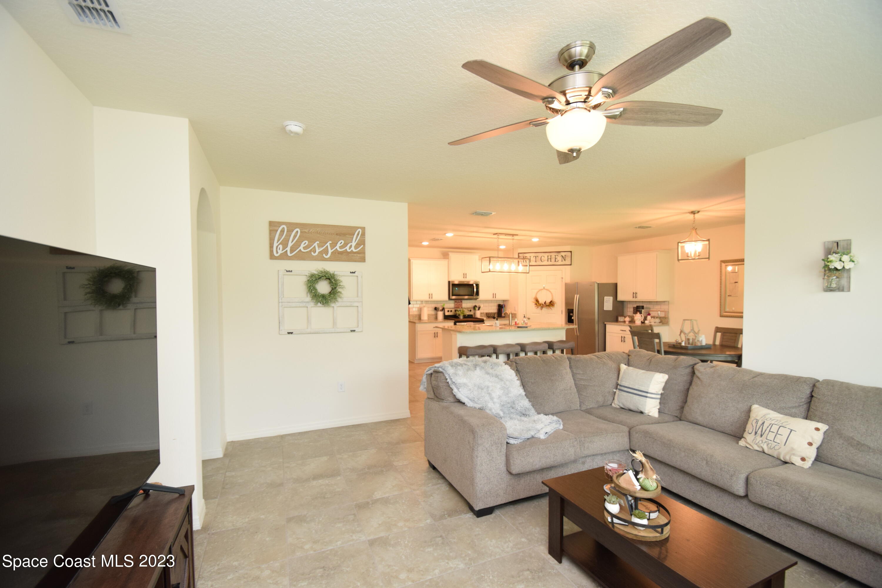 2103 Capital Drive Palm Bay, FL 32909 - Photo 47 of 84 a living room with furniture and a view of kitchen