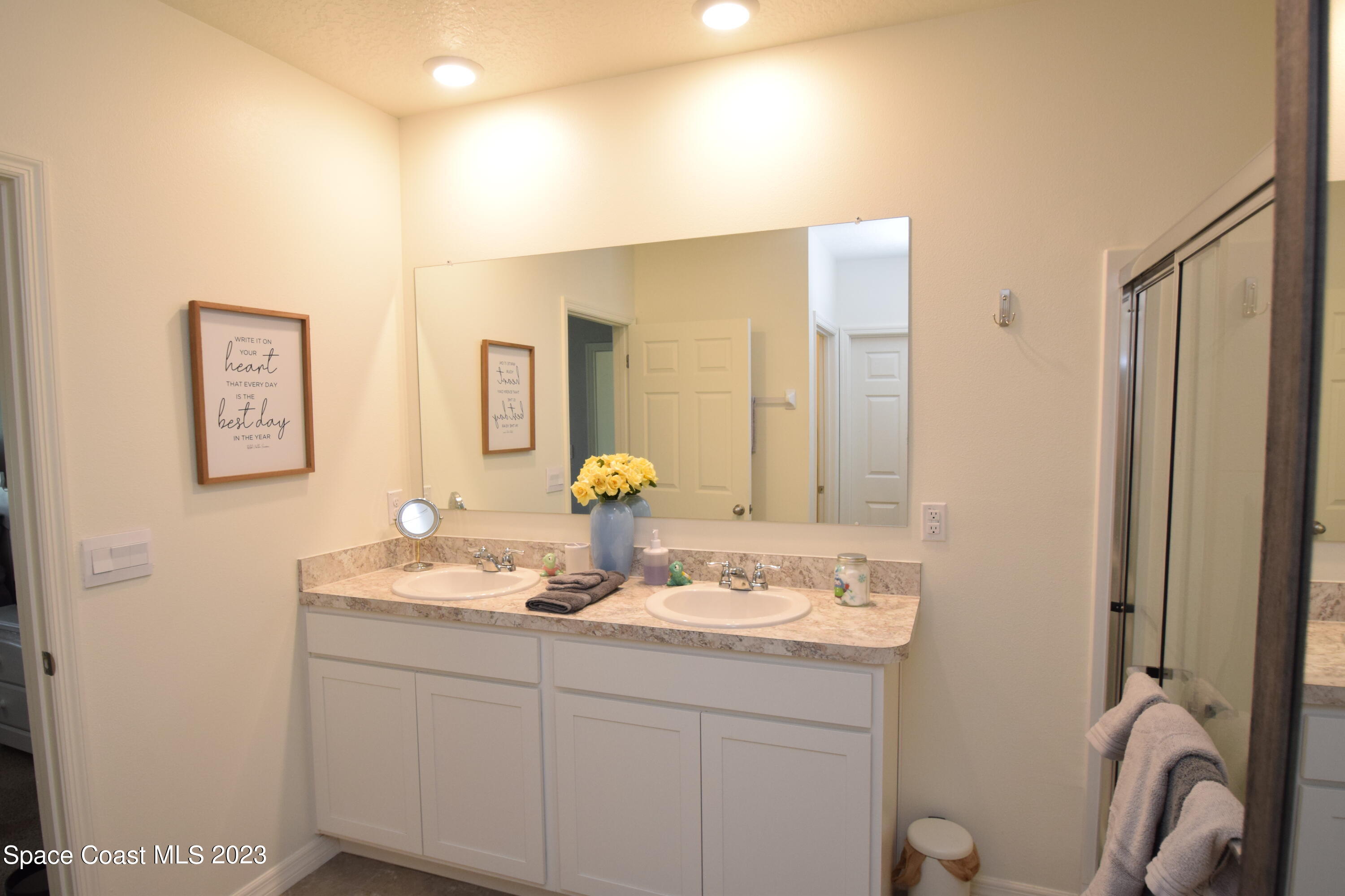 2103 Capital Drive Palm Bay, FL 32909 - Photo 54 of 84 a bathroom with a sink and a mirror