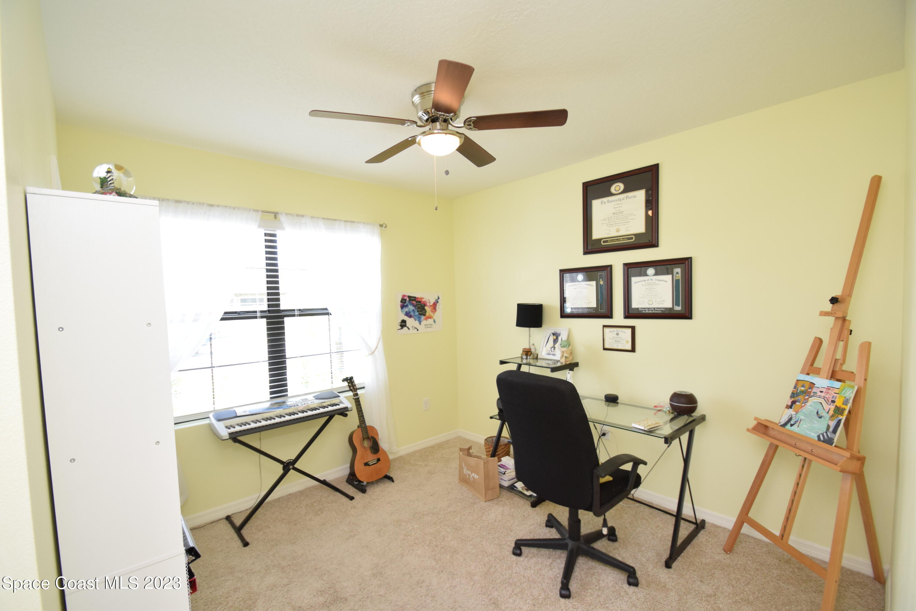 2103 Capital Drive Palm Bay, FL 32909 - Photo 56 of 84 a living room with furniture and a window