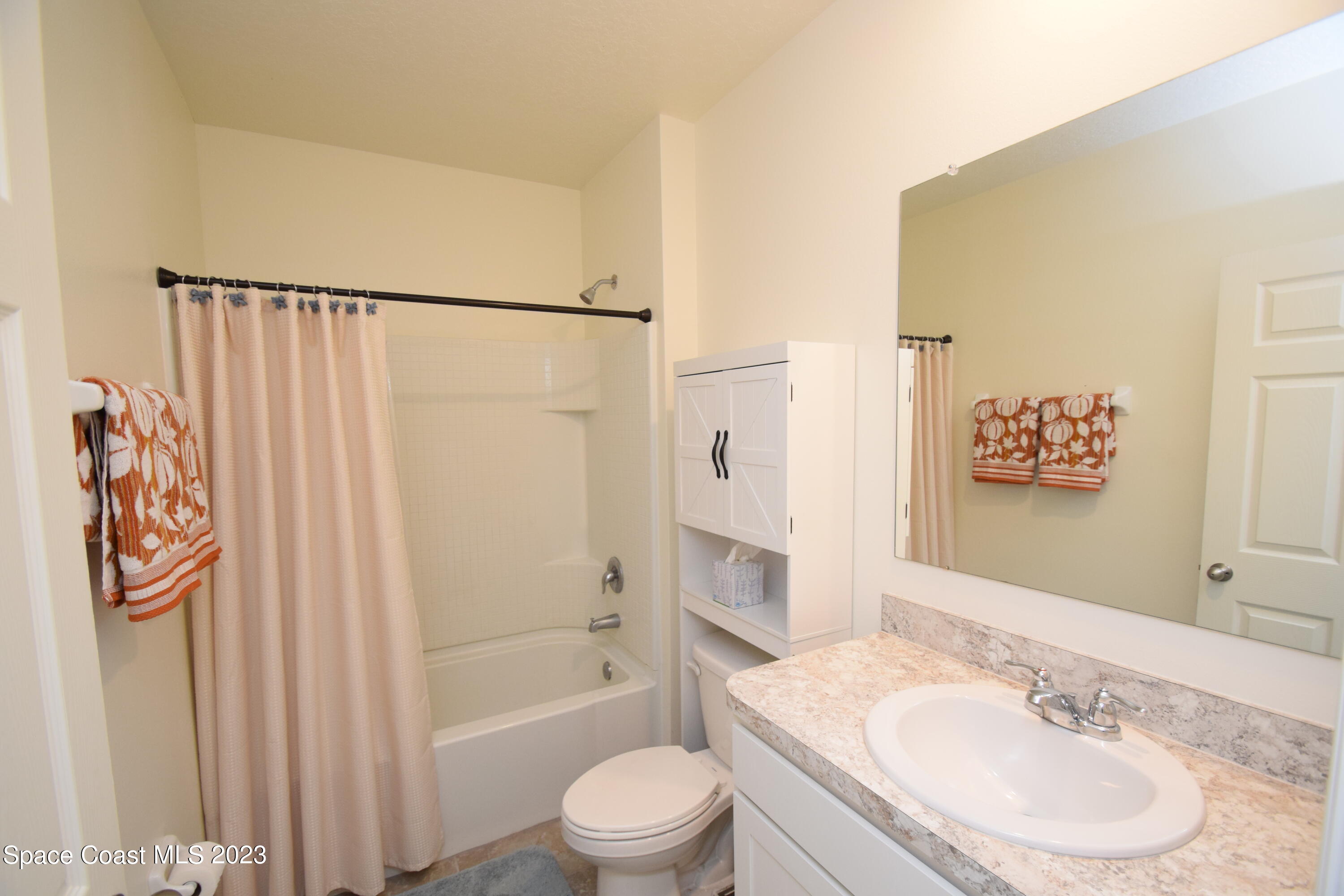 2103 Capital Drive Palm Bay, FL 32909 - Photo 58 of 84 a bathroom with a granite countertop sink toilet and shower