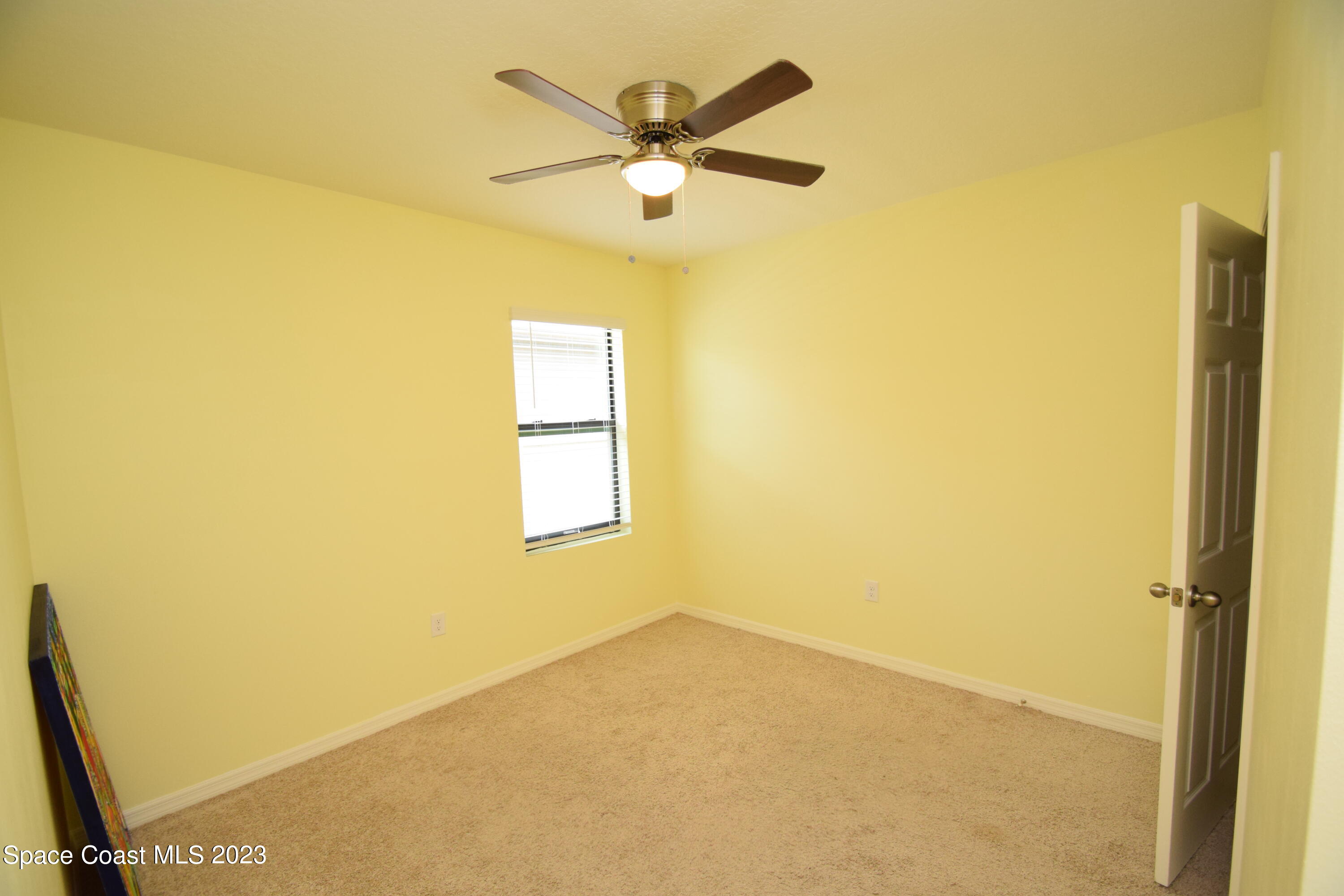 2103 Capital Drive Palm Bay, FL 32909 - Photo 61 of 84 a view of an empty room with a window