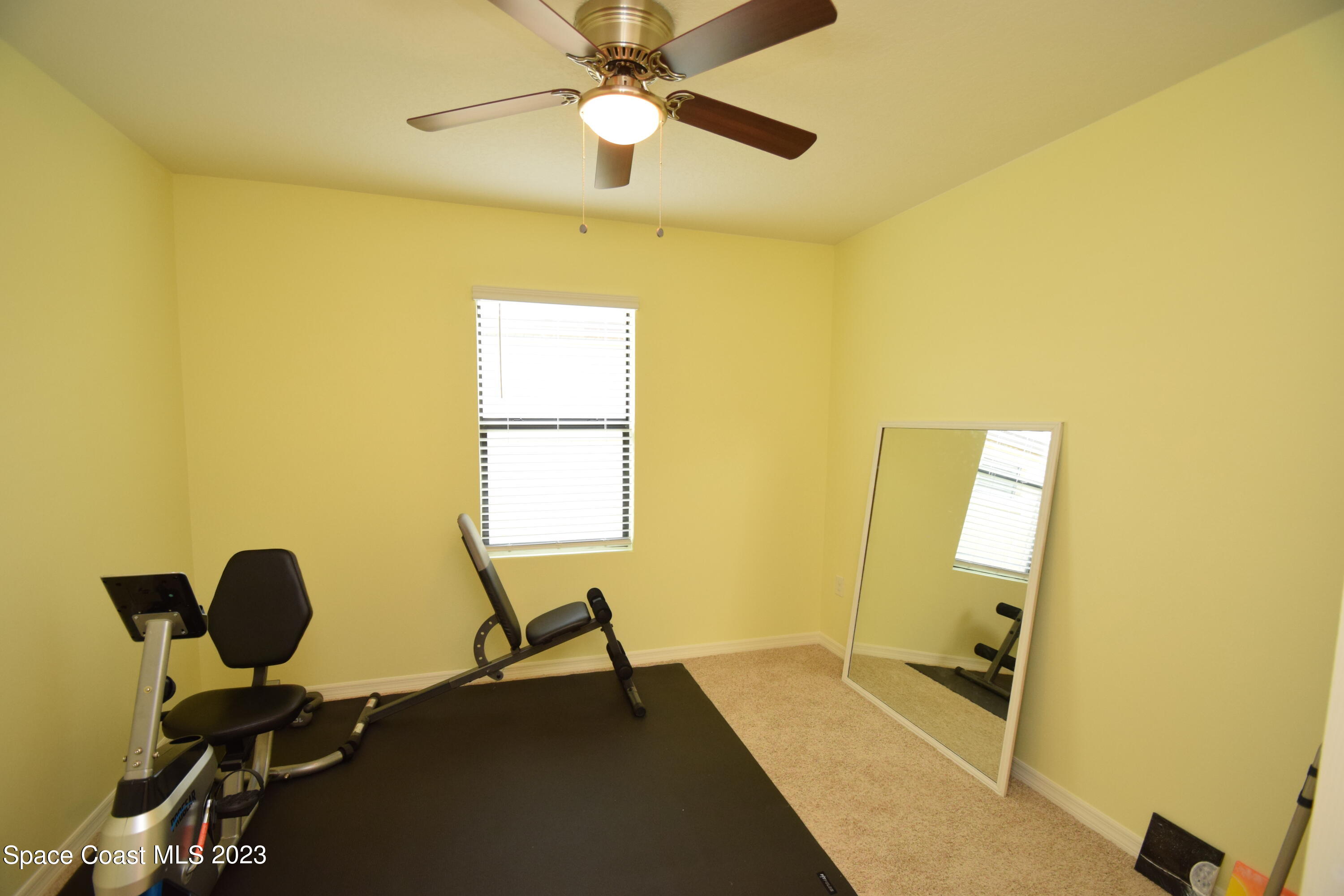 2103 Capital Drive Palm Bay, FL 32909 - Photo 63 of 84 a view of a workspace with furniture and a window