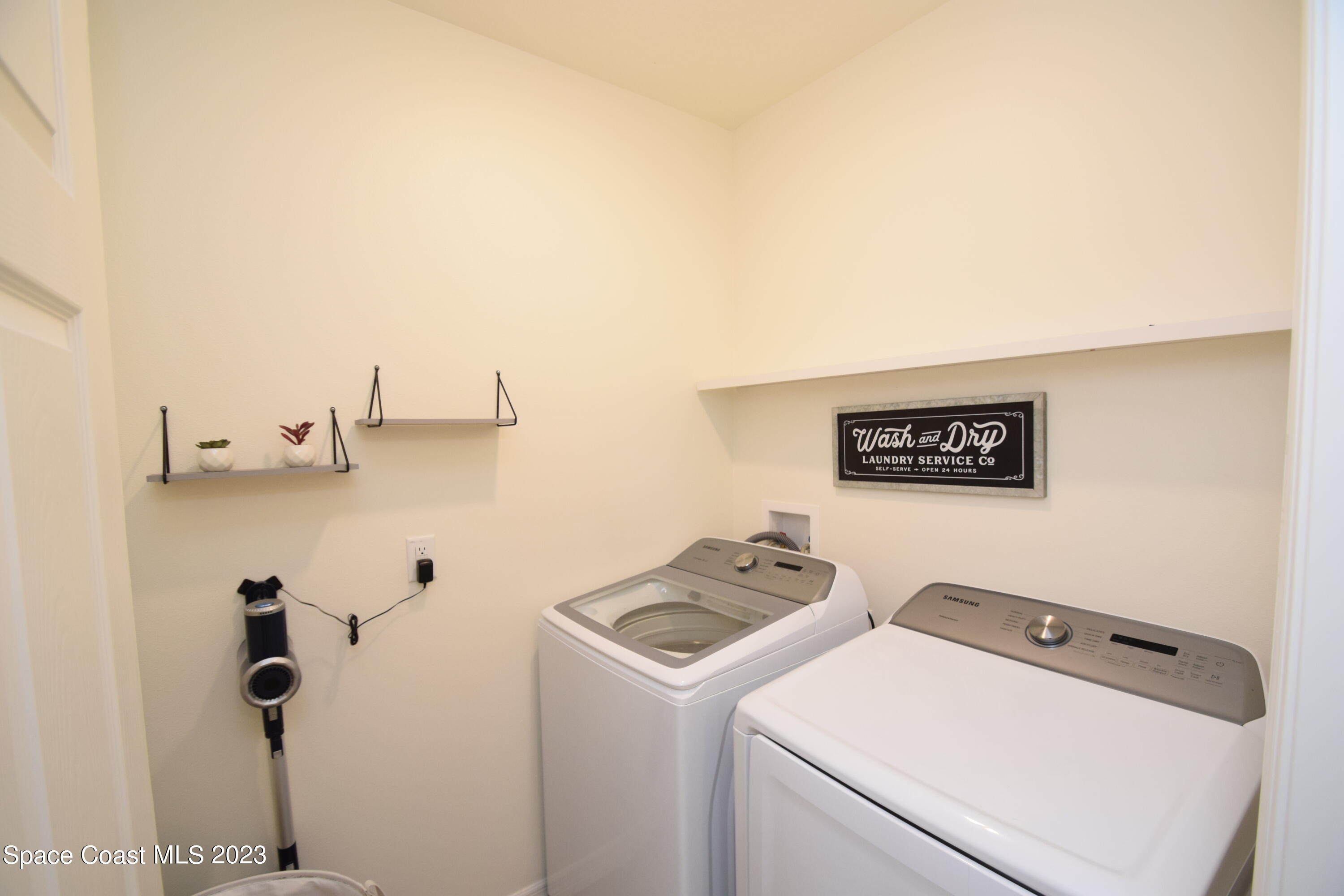 2103 Capital Drive Palm Bay, FL 32909 - Photo 64 of 84 a utility room with dryer and washer