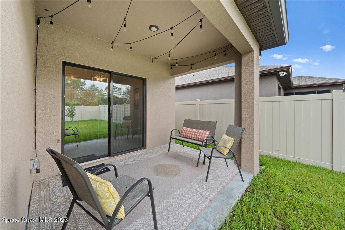 2103 Capital Drive Palm Bay, FL 32909 - Photo 76 of 84 a building outdoor space with patio furniture and potted plants