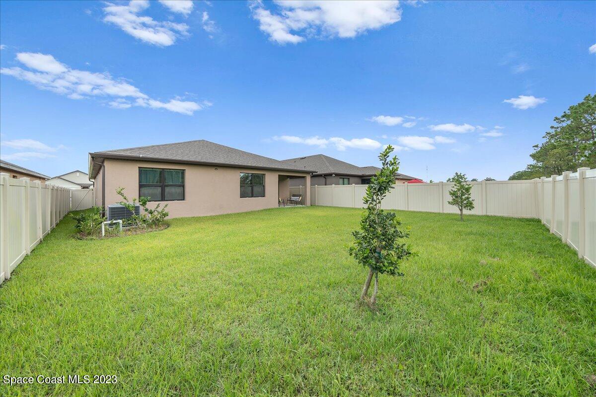 2103 Capital Drive Palm Bay, FL 32909 - Photo 77 of 84 a house view with a garden space