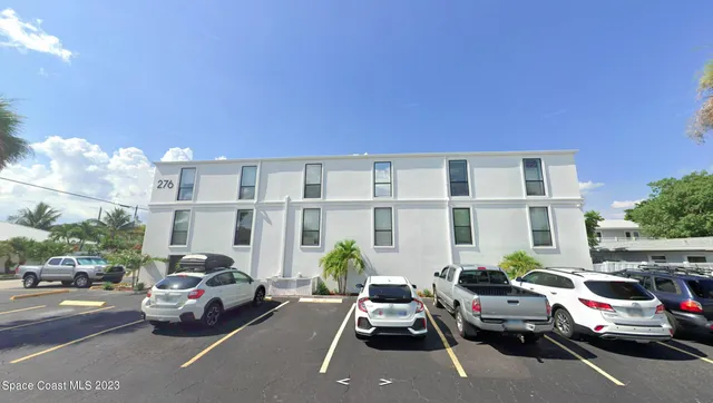 a view of a car parked in front of a house