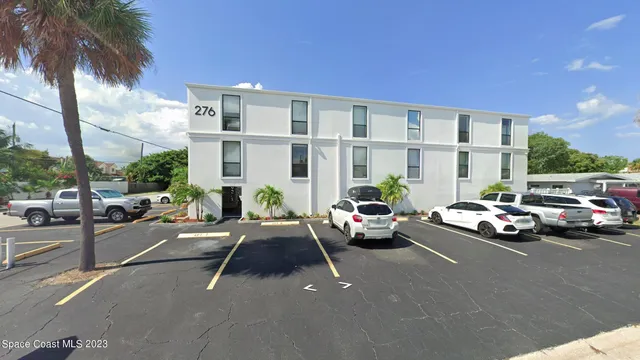 a cars parked in front of a building