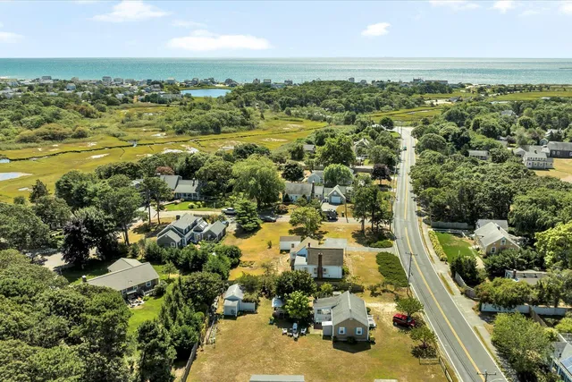 an aerial view of residential houses with outdoor space