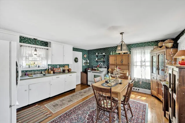 a kitchen with a table and chairs in it