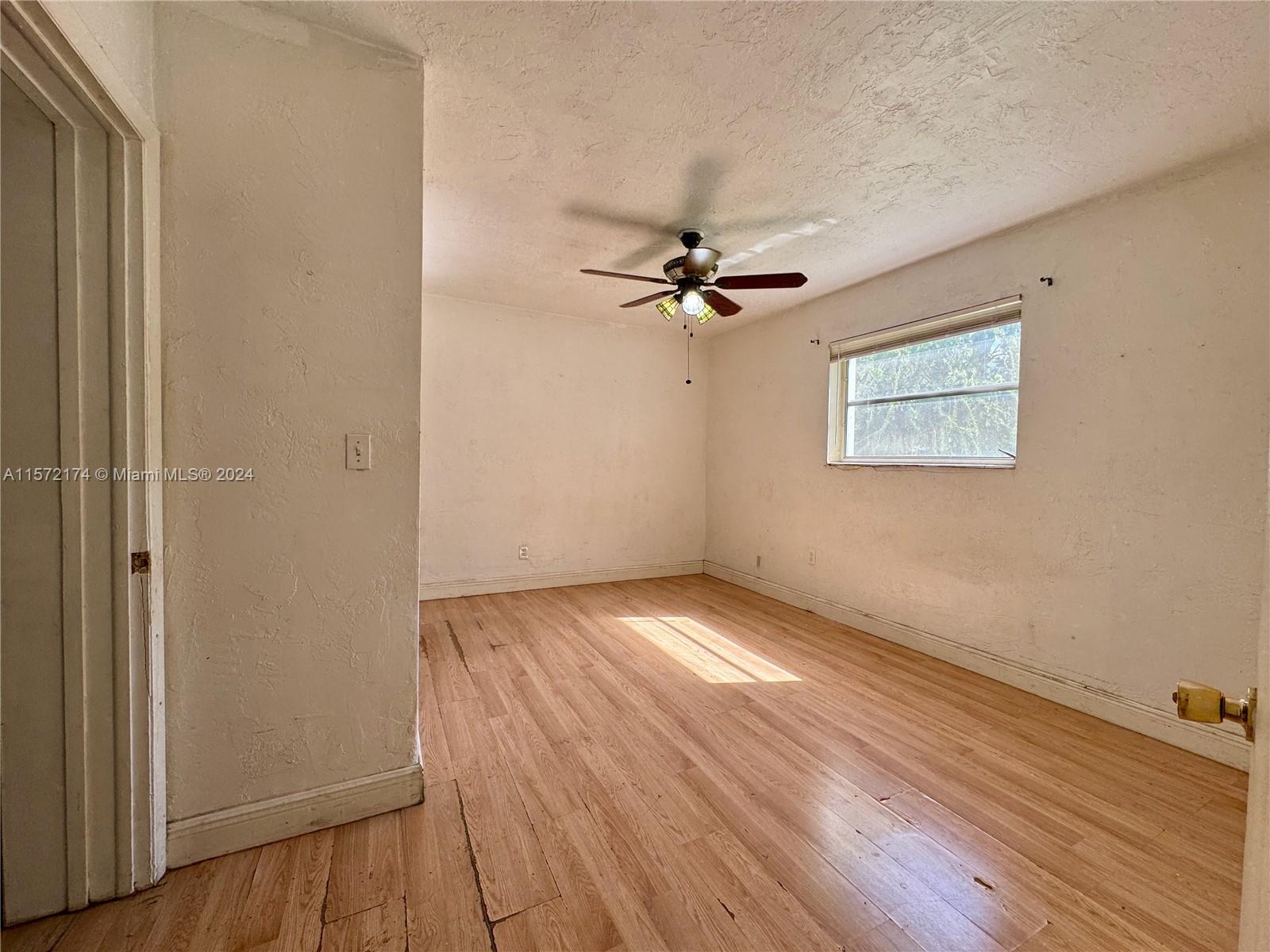 4250 Southwest 67th Avenue, Unit 6 Miami, FL 33155 - Photo 12 of 18 wooden floor in an empty room