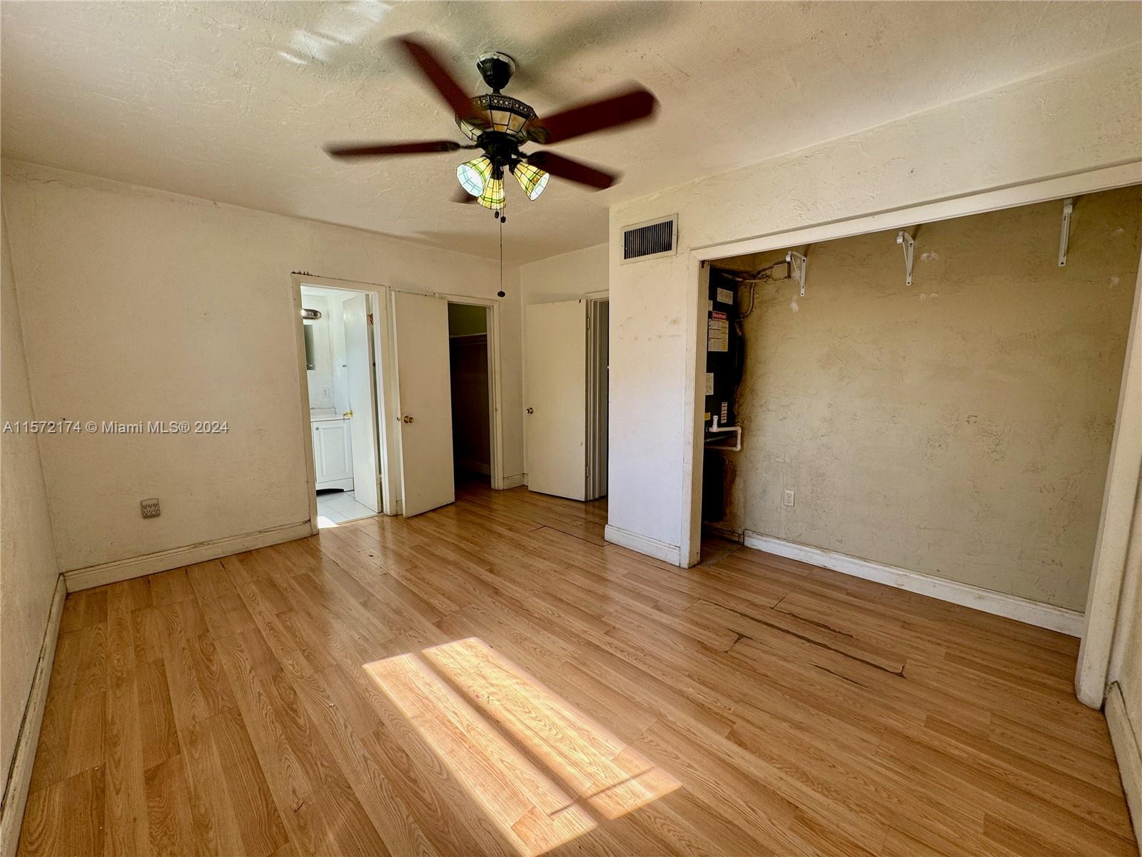 4250 Southwest 67th Avenue, Unit 6 Miami, FL 33155 - Photo 13 of 18 an empty room with wooden floor and ceiling fan