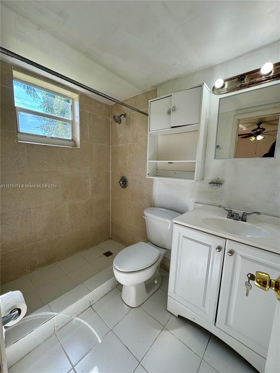 4250 Southwest 67th Avenue, Unit 6 Miami, FL 33155 - Photo 16 of 18 a bathroom with a sink a toilet and shower